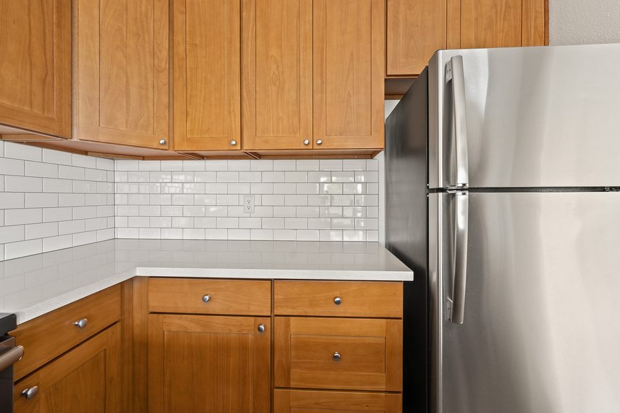 Kitchen cabinets and stainless refrigerator